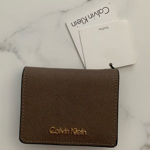 Brand new Calvin Klein Wallet (brown with gold emblem)
